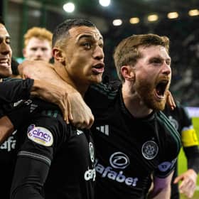 Celtic's Adam Idah celebrates with Anthony Ralston after netting late to beat Hibs.