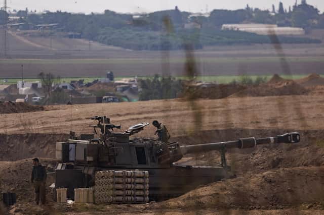 Israeli tanks and troops near the border with Gaza as ground operations, backed by airstrikes, against Hamas expanded yesterday. Picture: Dan Kitwood/Getty Images