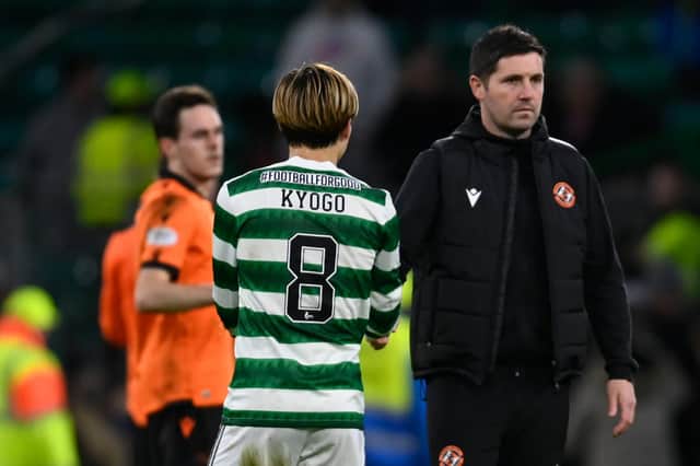 Dundee United manager Liam Fox shakes hands with Celtic's Kyogo Furuhashi after the 4-2 defeat at Celtic Park. (Photo by Rob Casey / SNS Group)