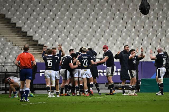 Scotland's players celebrate a famous victory over France last year - behind closed doors.