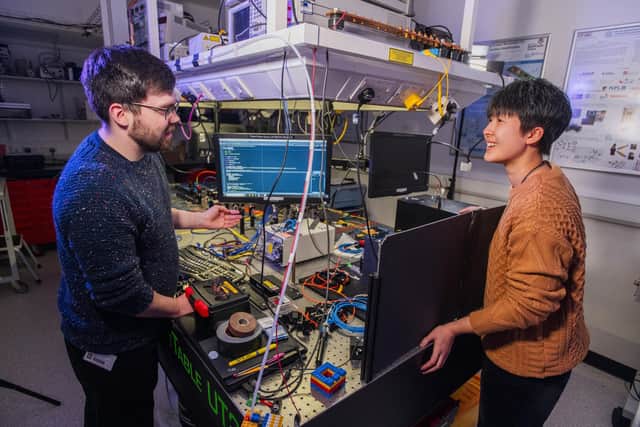Heriot-Watt PhD students Arran Sykes and Harmony Li in conversation regarding a quantum sensing system. Picture: Chris Watt Photography/Heriot-Watt University