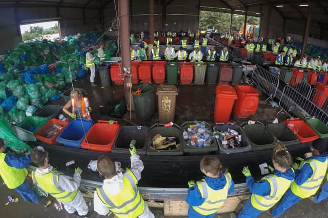 Collected rubbish is processed at the Glastonbury Festival's purpose-built recycling centre after festival-goers have left the site at Worthy Farm in Pilton