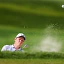 Bob MacIntyre splashes out of a bunker during the second round of the 105th PGA Championship at Oak Hill Country Club in Rochester, New York. Picture: Andrew Redington/Getty Images.