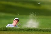 Bob MacIntyre splashes out of a bunker during the second round of the 105th PGA Championship at Oak Hill Country Club in Rochester, New York. Picture: Andrew Redington/Getty Images.