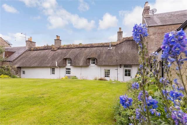 The 18th-century cottage boasts an A-listed thatched roof and retains many period features