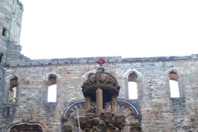 Red spraypaint was used to deface the top of the James V fountain, which sits in the central courtyard of the palace. PIC: HES.