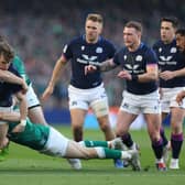 Darcy Graham finds his path blocked by Ireland's Hugo Keenan and Garry Ringrose. (Photo by Richard Heathcote/Getty Images)