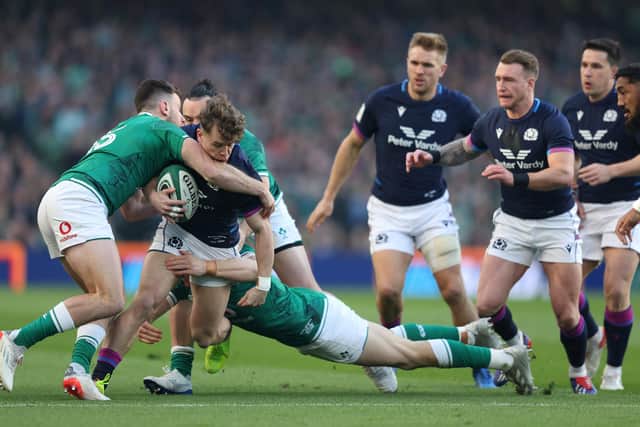 Darcy Graham finds his path blocked by Ireland's Hugo Keenan and Garry Ringrose. (Photo by Richard Heathcote/Getty Images)