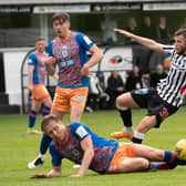 Queen's Park defender Peter Grant slides into a challenge on Dunfermline's Liam Polwarth during the Championship play-off semi-final second leg at East End Park. (Photo by Sammy Turner / SNS Group)