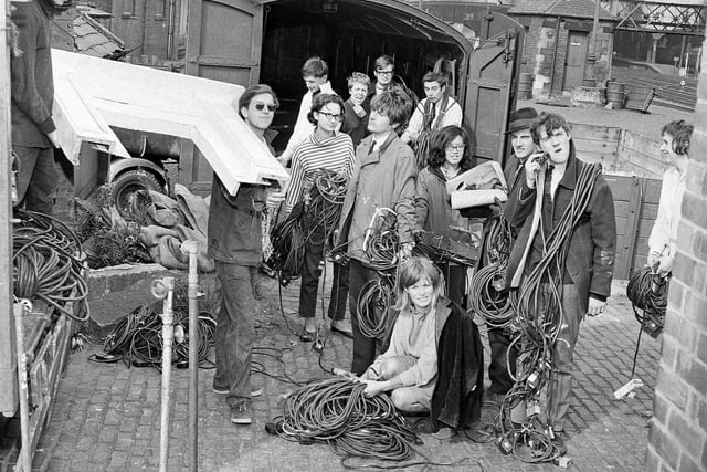 Oxford Theatre Group at the Edinburgh Festival Fringe in 196, including Michael Palin (right, shaving with electrical plug) and Terry Jones (to rear, wires draped round neck).
