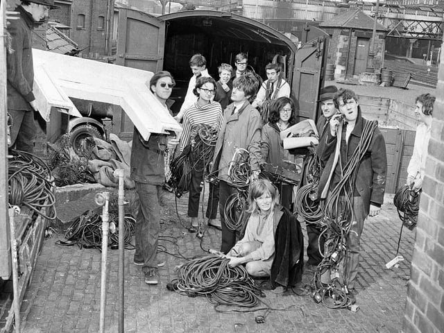 Oxford Theatre Group at the Edinburgh Festival Fringe in 196, including Michael Palin (right, shaving with electrical plug) and Terry Jones (to rear, wires draped round neck).