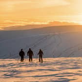 Skiers enjoy the sunset from near the top of the Buzzard tow at The Lecht PIC: Stevie McKenna / ski-scotland