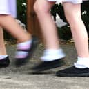 School girls walking to school. Photo credit should read: Ian West/PA Wire