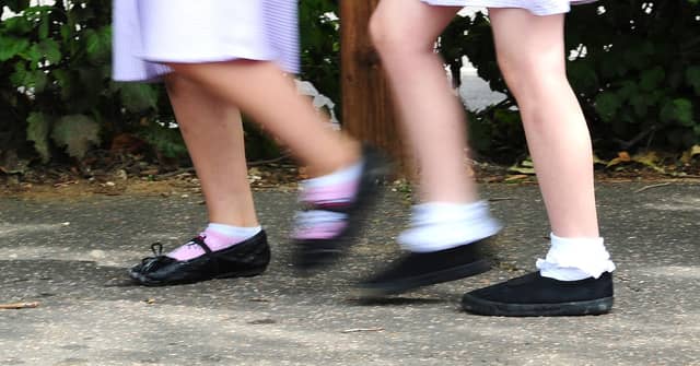 School girls walking to school. Photo credit should read: Ian West/PA Wire
