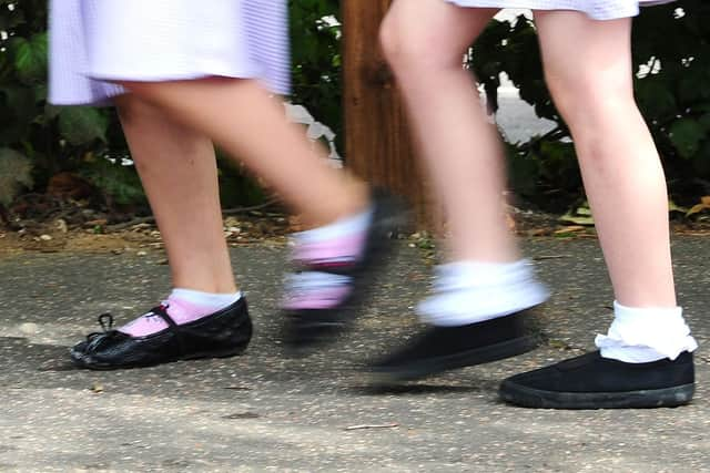 School girls walking to school. Photo credit should read: Ian West/PA Wire