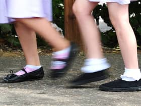School girls walking to school. Photo credit should read: Ian West/PA Wire