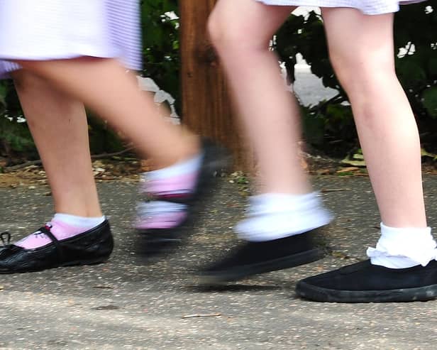 School girls walking to school. Photo credit should read: Ian West/PA Wire