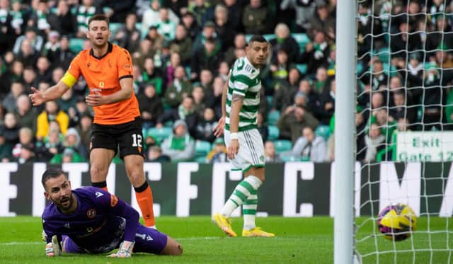 Dundee United goalkeeper Mark Birighitti can only watch as Sead Haksabanovic's shot creeps over the line in the 4-2 defeat to Celtic. (Photo by Craig Foy / SNS Group)