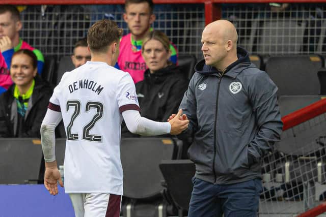 Hearts' Aidan Denholm with manager Steven Naismith as he is subbed off during the match at Ross County on September 30. (Photo by Mark Scates / SNS Group)