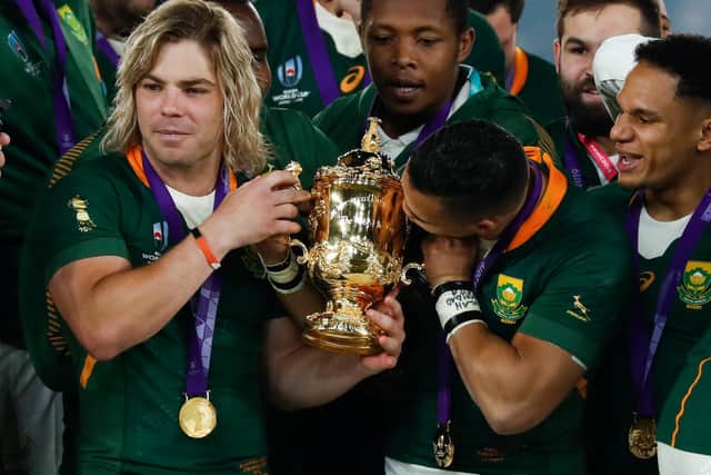 South Africa's scrum-half Faf de Klerk, left, celebrates after the springboks' Rugby World Cup final victory over England in 2019. Picture: AFP via Getty Images