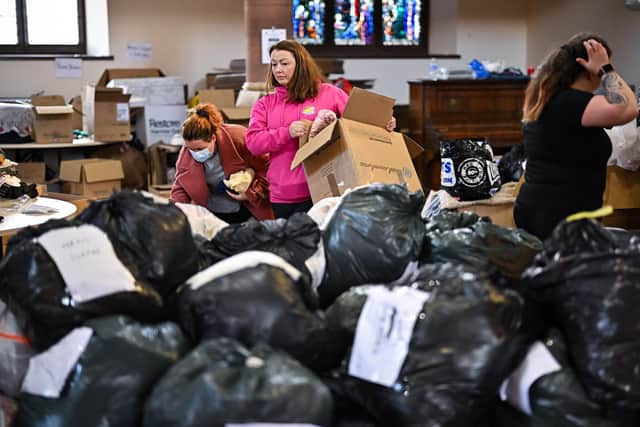Volunteers sort through donations for Ukraine given to Rain or Shine South Lanarkshire at Old Trinity Church in Cambuslang. Picture: Jeff J Mitchell/Getty Images