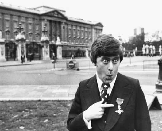 Mike Yarwood joking around outside Buckingham Palace after receiving his investiture from Queen Elizabeth II in 1976 (Picture: Monti Spry/Central Press/Getty Images)