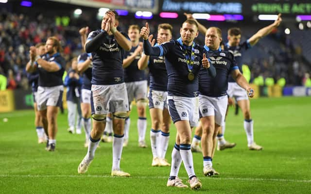 Man of the match Finn Russell celebrates Scotland's victory over Wales and a hat-trick of dazzling set-ups