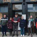 John Swinney pictured with service users outside the Giraffe café and training kitchen in Perth. Picture: Becky Duncan