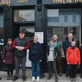 John Swinney pictured with service users outside the Giraffe café and training kitchen in Perth. Picture: Becky Duncan