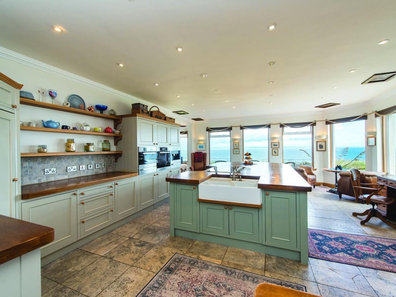The current owner says: “It needed renovation and my partner saw the opportunity to add to the floor plan while reorienting the house to face the sea and the views.”