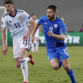 Scotland midfielder Ryan Christie (L) in a race with Israel defender Sheran Yeini during the UEFA Nations League B Group 2 football match between Israel and Scotland at the Netanya Municipal Stadium (Photo by JACK GUEZ / AFP) (Photo by JACK GUEZ/AFP via Getty Images)