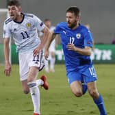 Scotland midfielder Ryan Christie (L) in a race with Israel defender Sheran Yeini during the UEFA Nations League B Group 2 football match between Israel and Scotland at the Netanya Municipal Stadium (Photo by JACK GUEZ / AFP) (Photo by JACK GUEZ/AFP via Getty Images)
