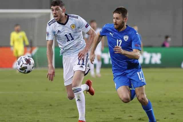 Scotland midfielder Ryan Christie (L) in a race with Israel defender Sheran Yeini during the UEFA Nations League B Group 2 football match between Israel and Scotland at the Netanya Municipal Stadium (Photo by JACK GUEZ / AFP) (Photo by JACK GUEZ/AFP via Getty Images)