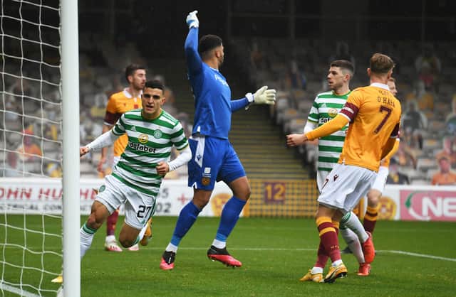 Mohamed Elyounoussi scores to put Celtic ahead at Fir Park. Picture: SNS