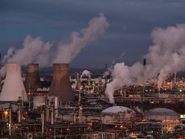 Experts are calling for urgent cuts to greenhouse gas emissions as the world experiences a full year of warming above 1.5C  for the first time
