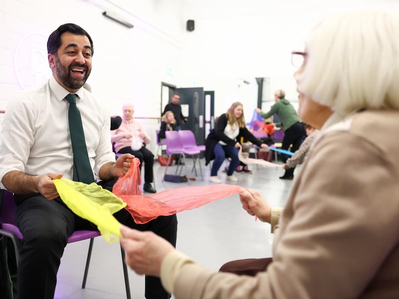 Humza Yousaf takes part in a dance performance during a visit to the Edinburgh Community Performing Arts re-connect project