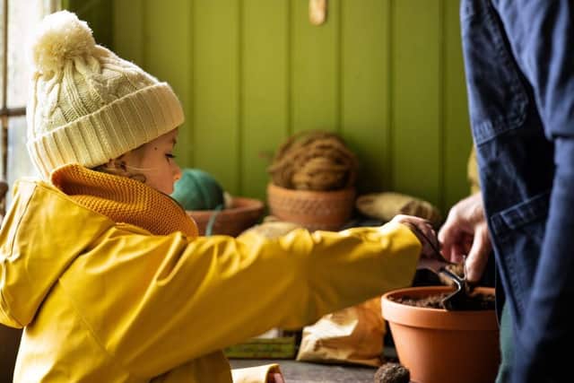 Busy in the potting shed. Lifestyle photography.
