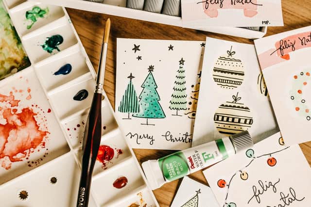 Christmas cards can often be recycled, but watch out for foil or glitter. Photo: Jonathan Berba / Pexels / Canva Pro.