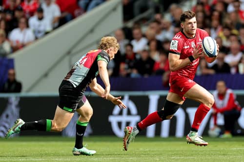 Blair Kinghorn of Toulouse gets away from Louis Lynagh during the victory over Harlequins.