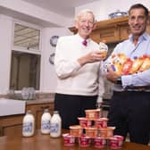 Mr Graham with his son Robert Graham (Managing Director) with some of their protein products.