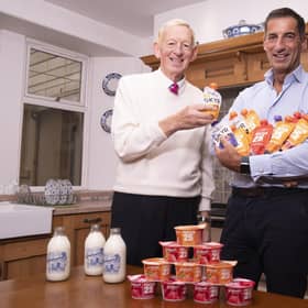 Mr Graham with his son Robert Graham (Managing Director) with some of their protein products.