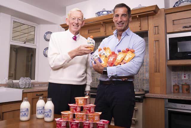 Mr Graham with his son Robert Graham (Managing Director) with some of their protein products.