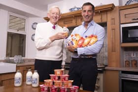 Mr Graham with his son Robert Graham (Managing Director) with some of their protein products.