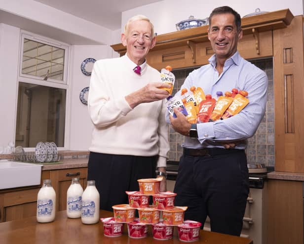 Mr Graham with his son Robert Graham (Managing Director) with some of their protein products.