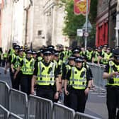 Police officers on the Royal Mile in Edinburgh before Queen Elizabeth II's coffin was transported on a six-hour journey from Balmoral to the Palace of Holyroodhouse in Edinburgh.