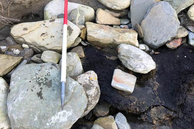 A section of wall which has been exposed at the Bay of Skaill which may have been part of an undiscovered Neolithic settlement. PIC: Contributed.