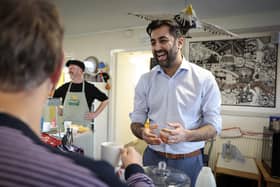 Humza Yousaf, seen at a community cafe in Dalkeith, claims there was a cock-up, not a conspiracy, over the SNP's membership figures (Picture: Jeff J Mitchell/Getty Images)