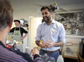Humza Yousaf, seen at a community cafe in Dalkeith, claims there was a cock-up, not a conspiracy, over the SNP's membership figures (Picture: Jeff J Mitchell/Getty Images)