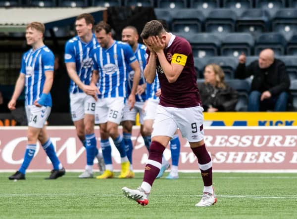 Kilmarnock players celebrate while Hearts captain Lawrence Shankland is dejected. (Photo by Mark Scates / SNS Group)