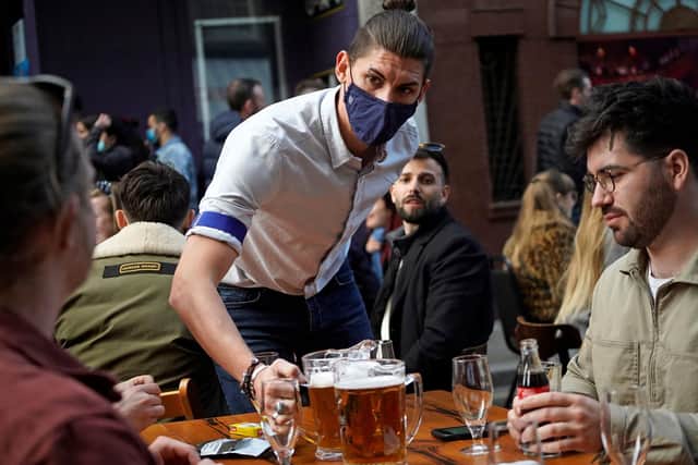 Outdoor drinking, as seen at this bar in London's Soho, will be allowed from tomorrow in Scotland, although conditions apply (Picture: Niklas Halle'n/AFP via Getty Images)